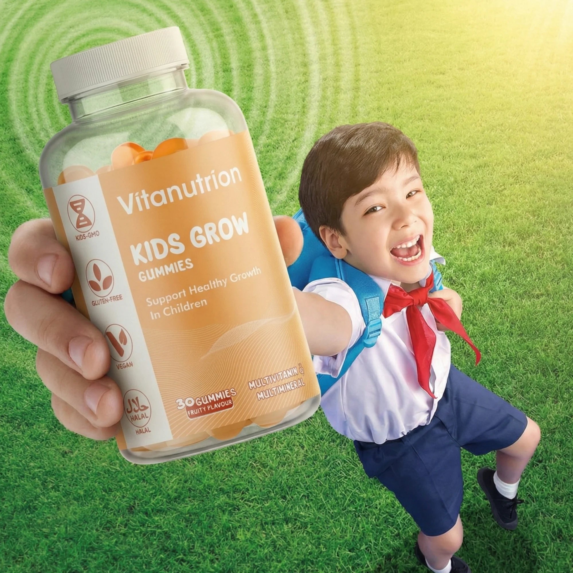 Vitanutrition Kids Grow Gummies bottle held by a hand with a child in school uniform running on grass.