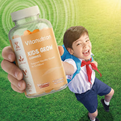 Vitanutrition Kids Grow Gummies bottle held by a hand with a child in school uniform running on grass.